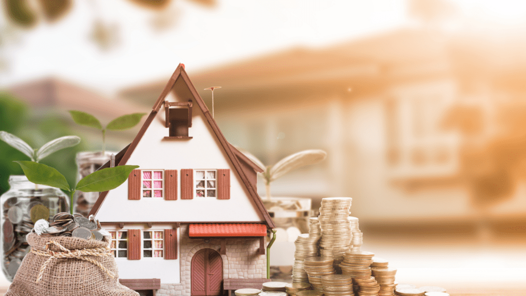 Picture of coins next to a model house