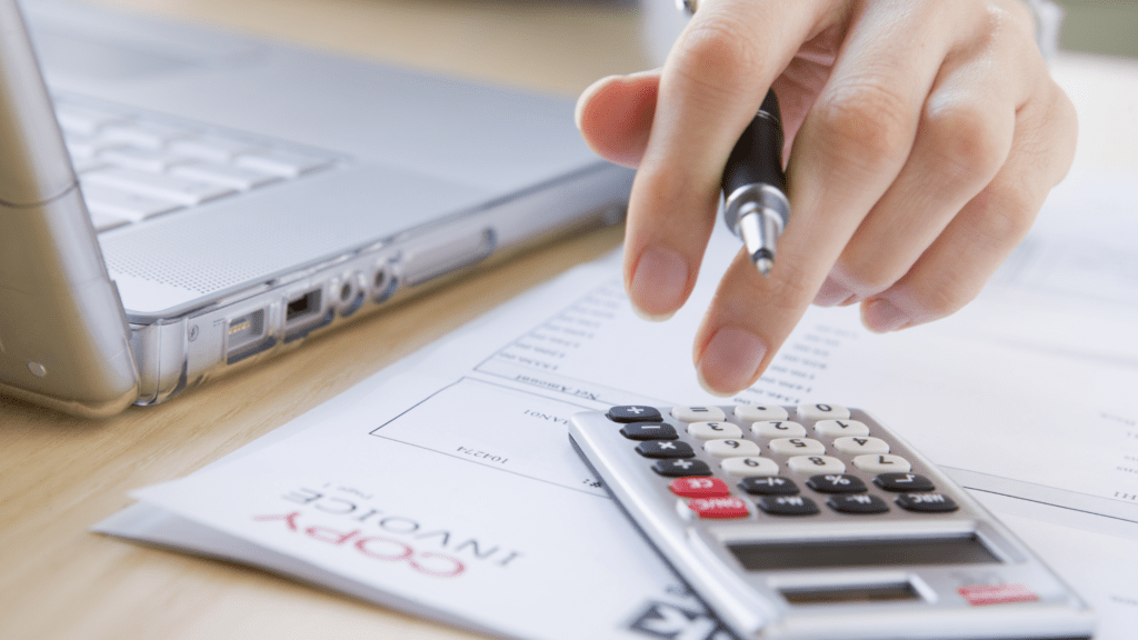 person calculating their household bills